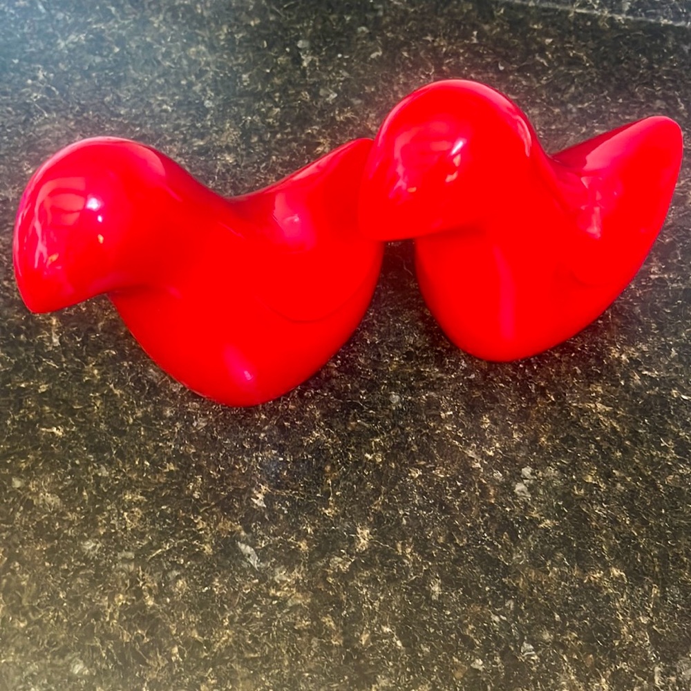 Pair of ceramic red bird figurines.